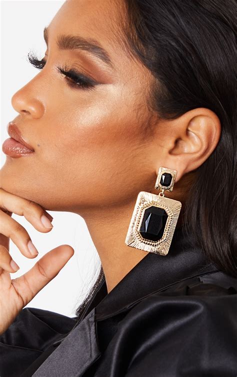 black and gold statement earrings.